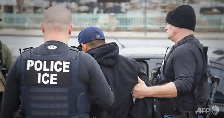 US Immigration and Customs Enforcement officers detaining a suspect during an enforcement operation on 7 February, 2017 in Los Angeles, California. Photo: AFP