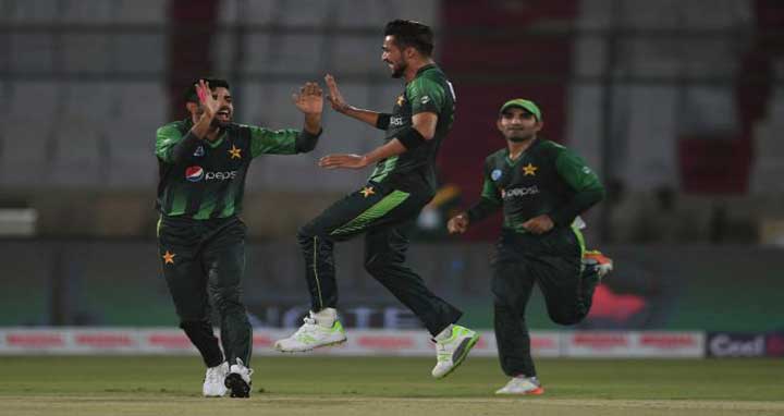 Pakistani cricketer Mohammad Amir © celebrates with teammates after taking the wickets of West Indies batsman Andre Fletcher during the first T20 cricket match between Pakistan and West Indies at The National Stadium in Karachi on Sunday. Photo: AFP